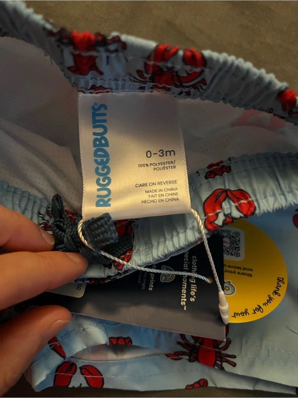 RuffleButts Light Blue Swim Trunks with Red Lobster Print